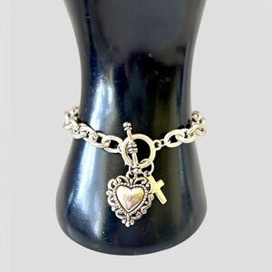 Brighton retired silver toned heart bracelet. Cross charm on Bracelet. Excellent